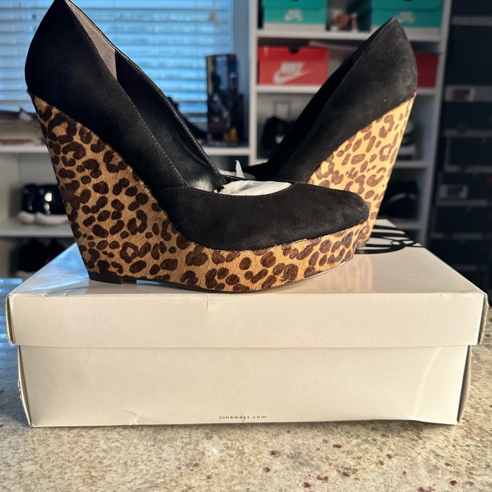 Women’s 9 West wedge heels. Black upper and animal print heel. New in box.